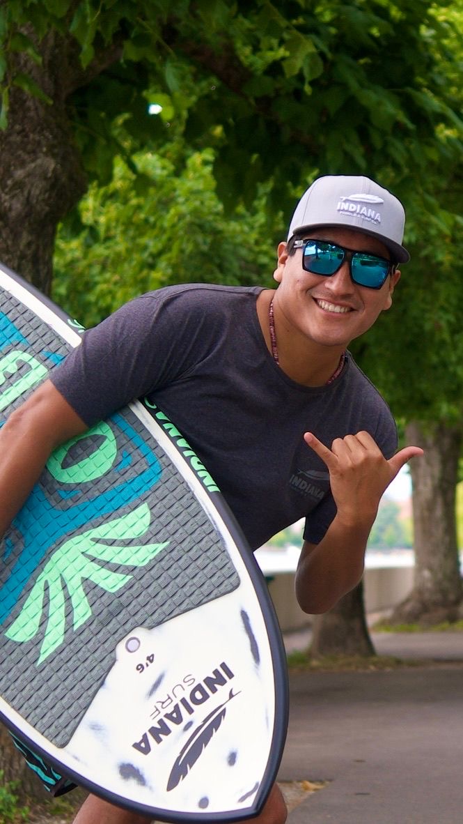 José Junior Huilcapaco with surfskate, urban setting